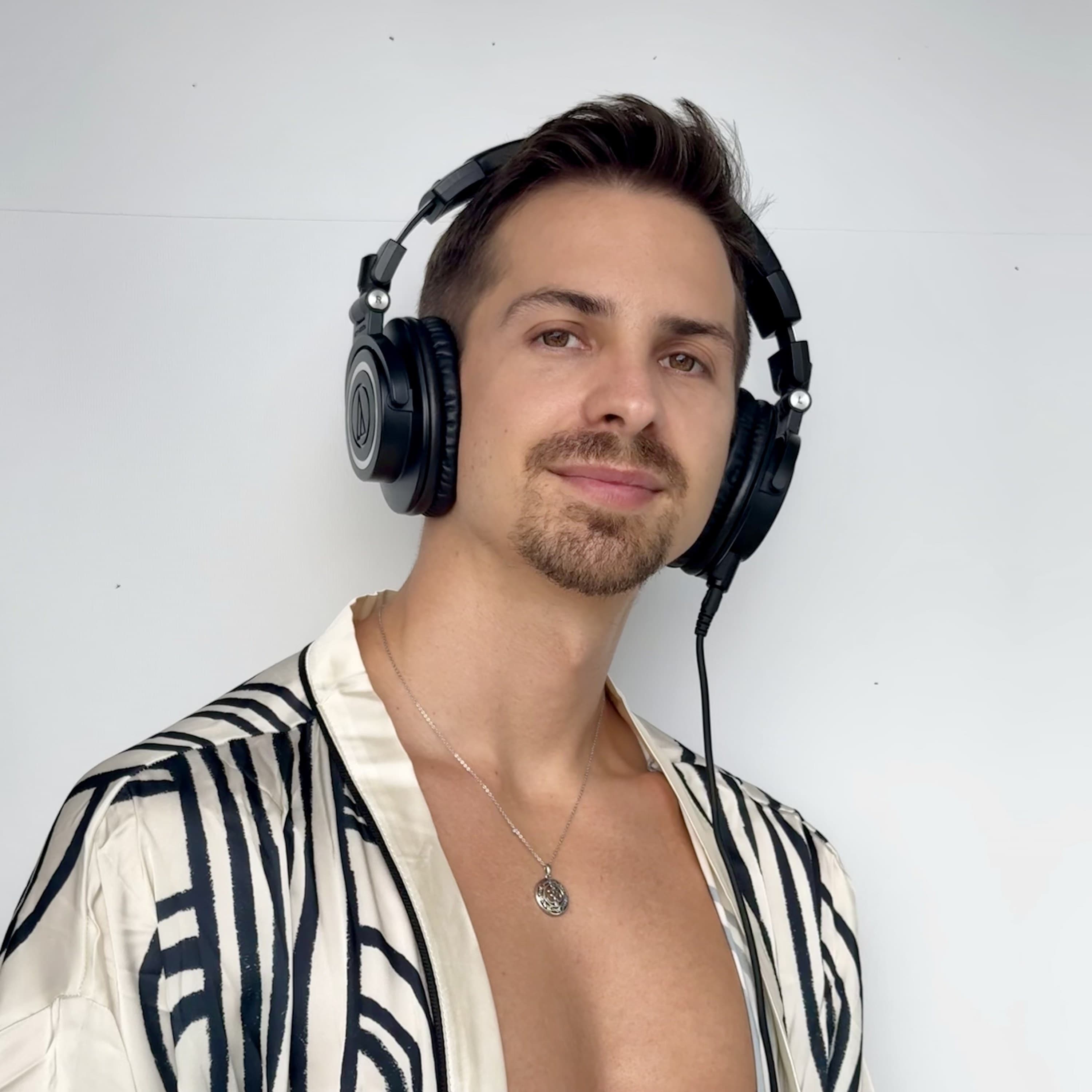 Headshot of Mike Mana with headphones